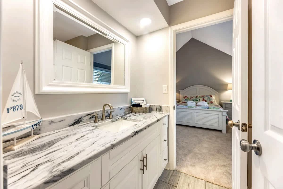 Refresh in your private bathroom featuring marble countertops and nautical touches, then retreat to your comfortable bedroom.