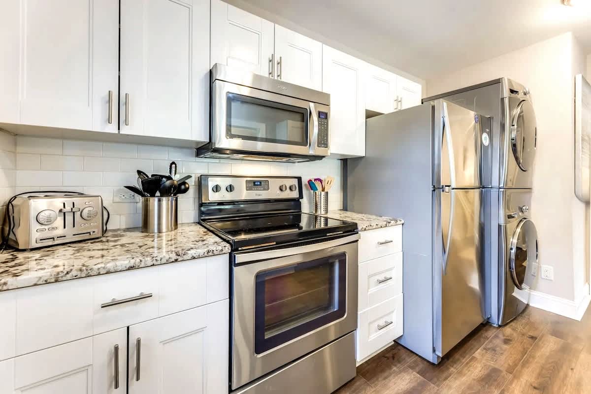 Your fully equipped modern kitchen features granite countertops, stainless steel appliances, and everything you need to create memorable meals during your stay.