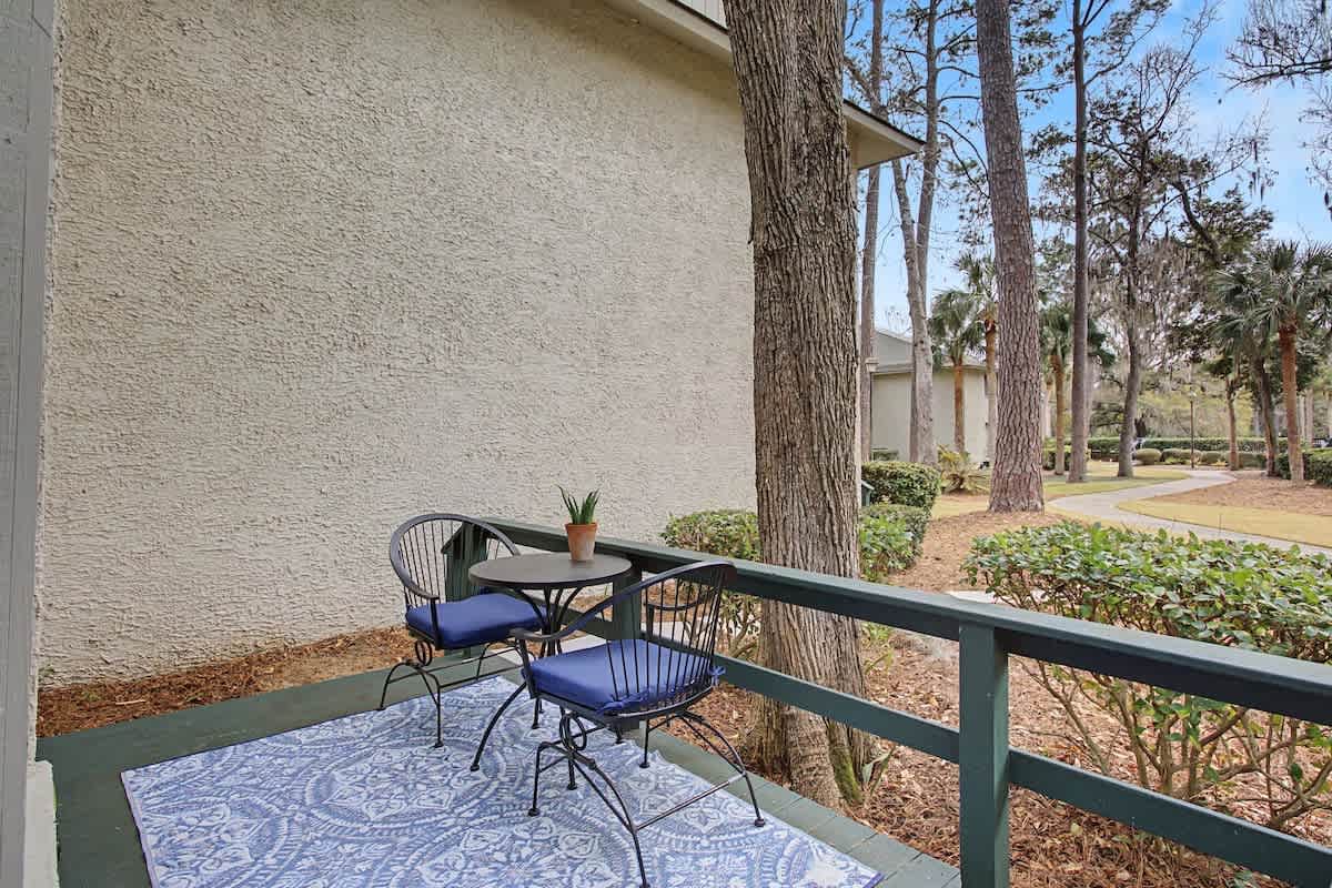 Enjoy morning coffee on your private balcony overlooking mature trees and peaceful gardens.