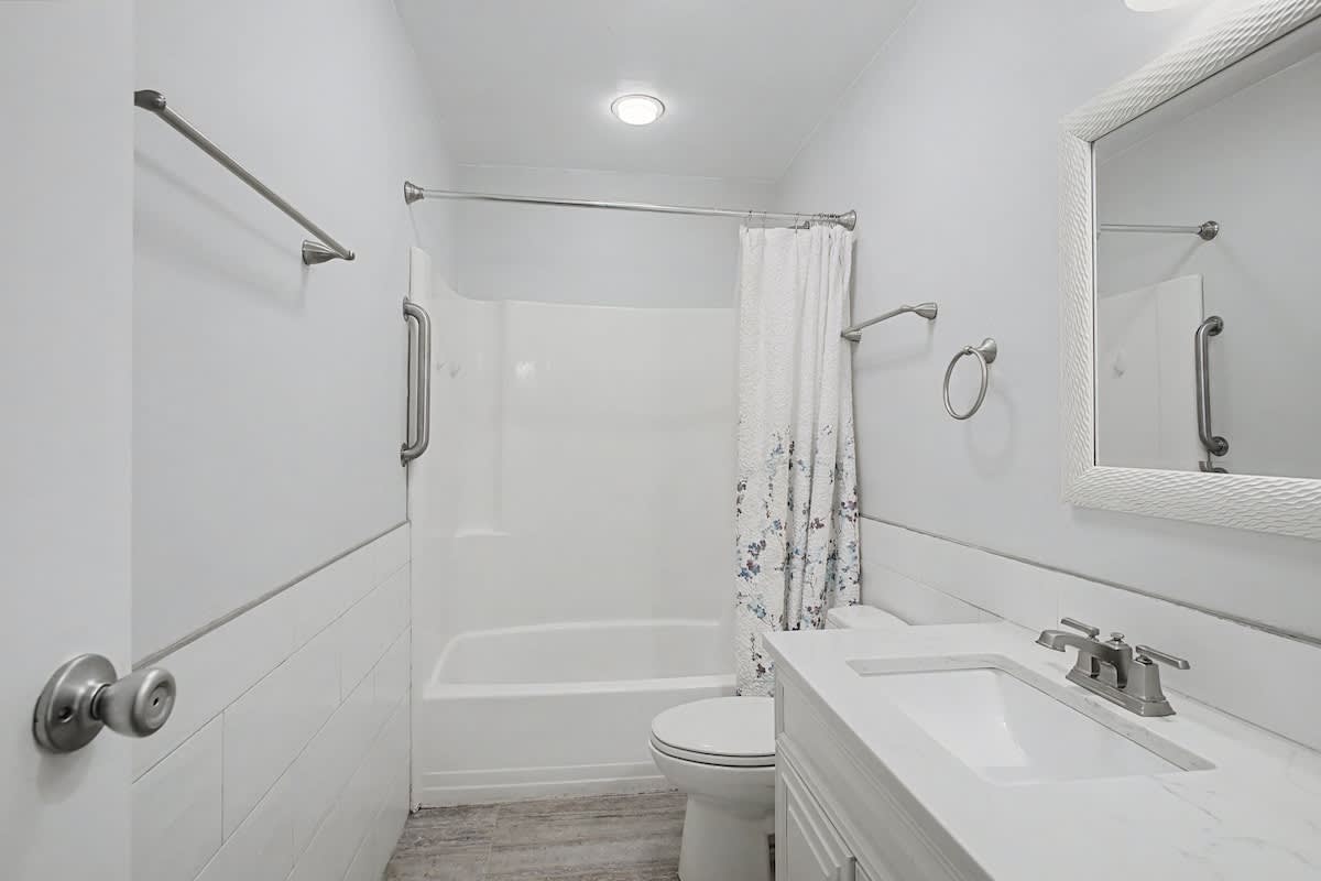 Step into your pristine bathroom with modern fixtures, grab bars for safety, and a relaxing tub-shower combo for unwinding after your adventures.