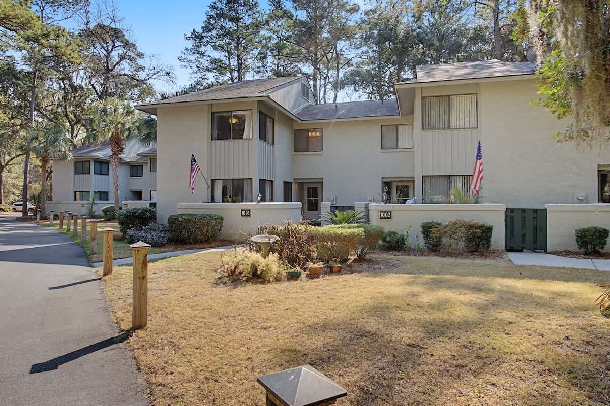 Modern townhome complex featuring well-maintained grounds and convenient walkways in a peaceful residential setting.