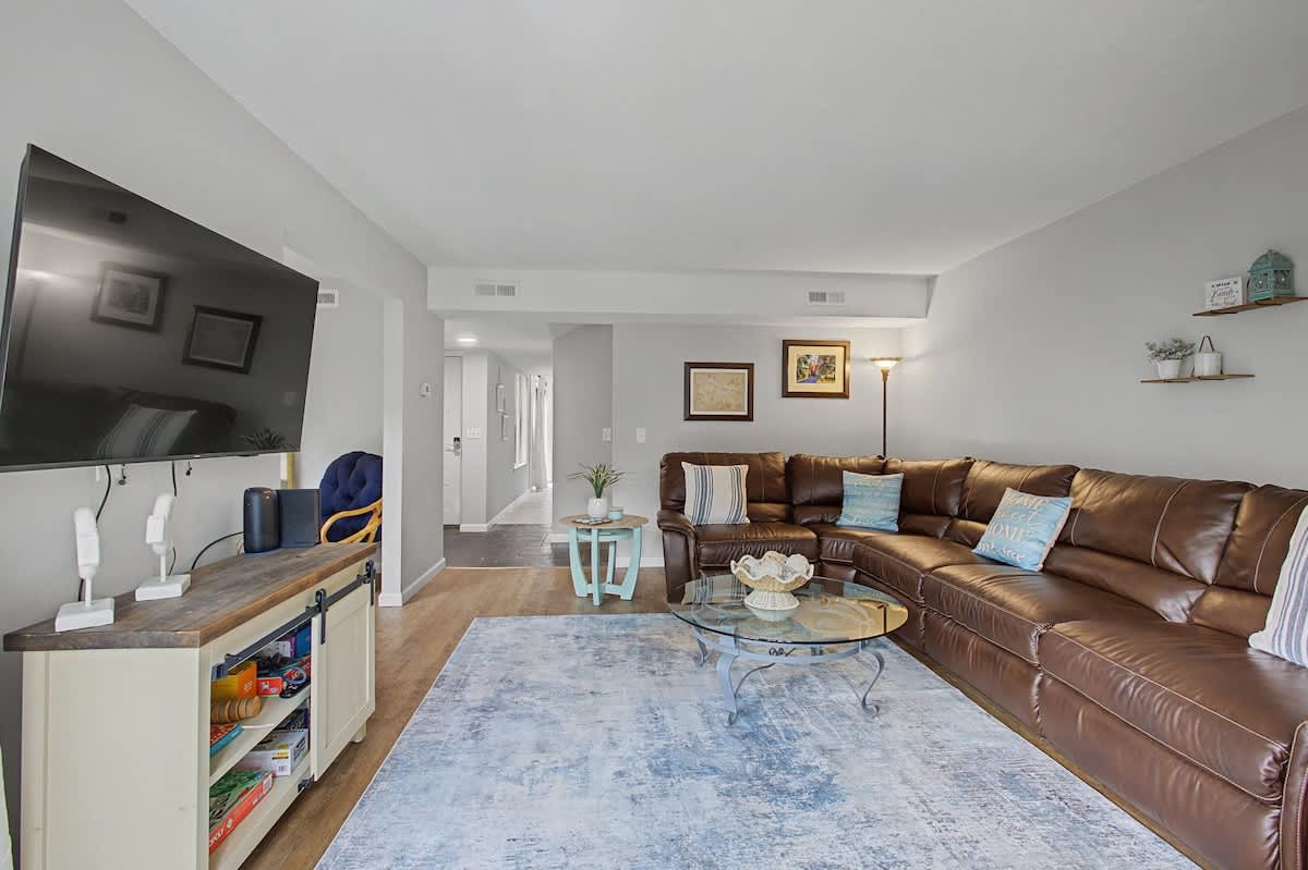 Sink into luxurious leather seating while enjoying your favorite shows on the wall-mounted TV in this thoughtfully designed living space.