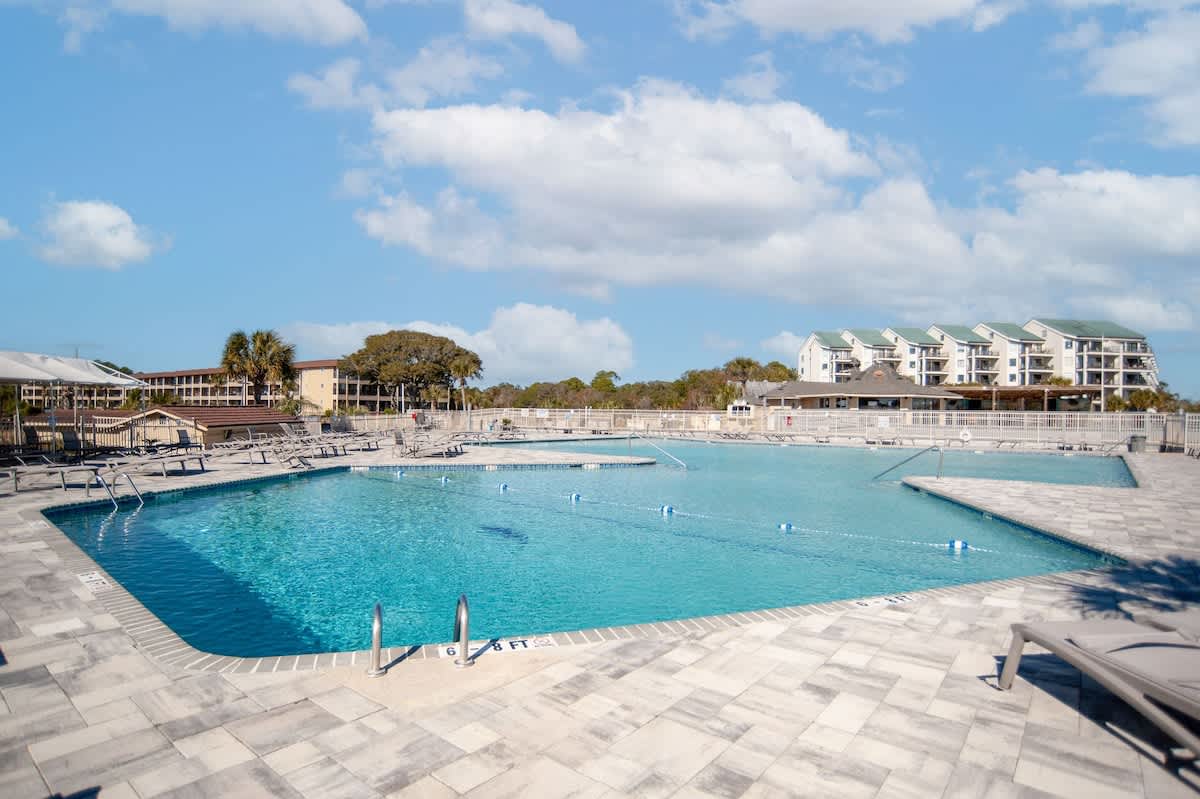 Spacious resort-style pool with crystal-clear waters and ample deck space for lounging under Florida's beautiful skies.