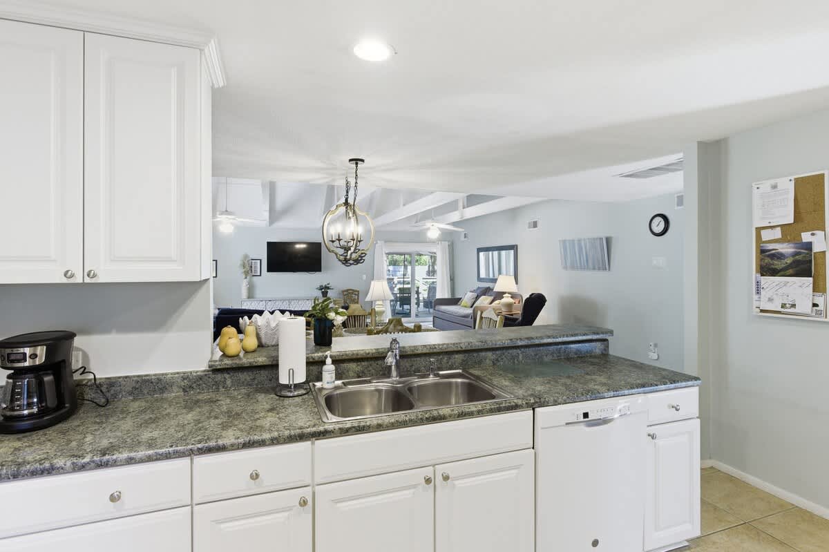 Your fully equipped kitchen opens seamlessly into the bright living area, perfect for preparing meals while staying connected with family and friends.