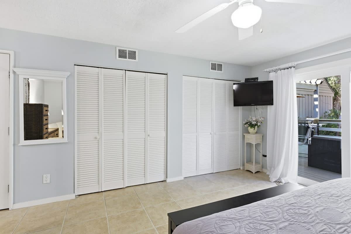 Relax in your spacious bedroom with abundant closet storage and modern amenities for a comfortable stay.