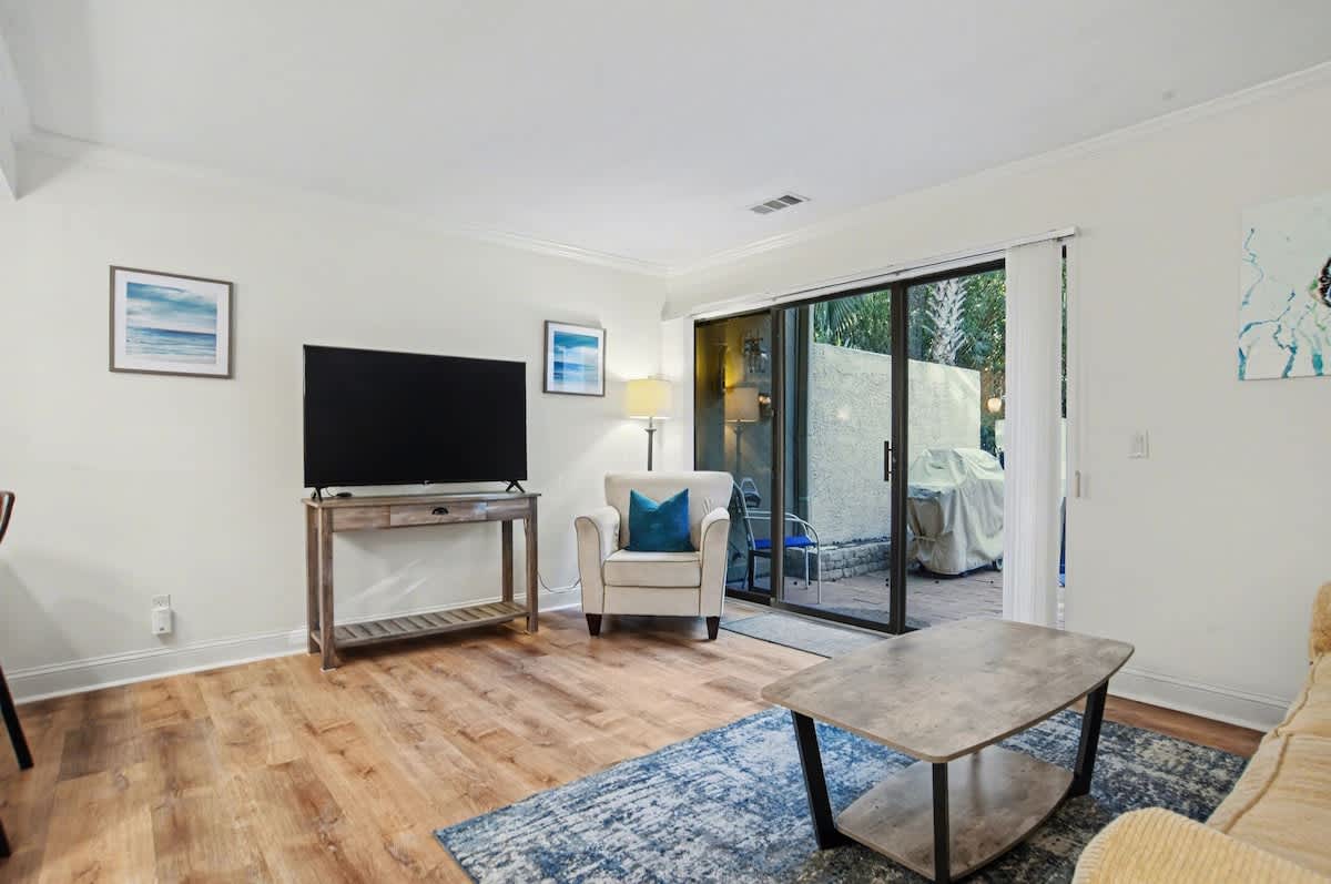 Unwind in your bright living room where comfortable seating and natural light create the perfect space for relaxation.