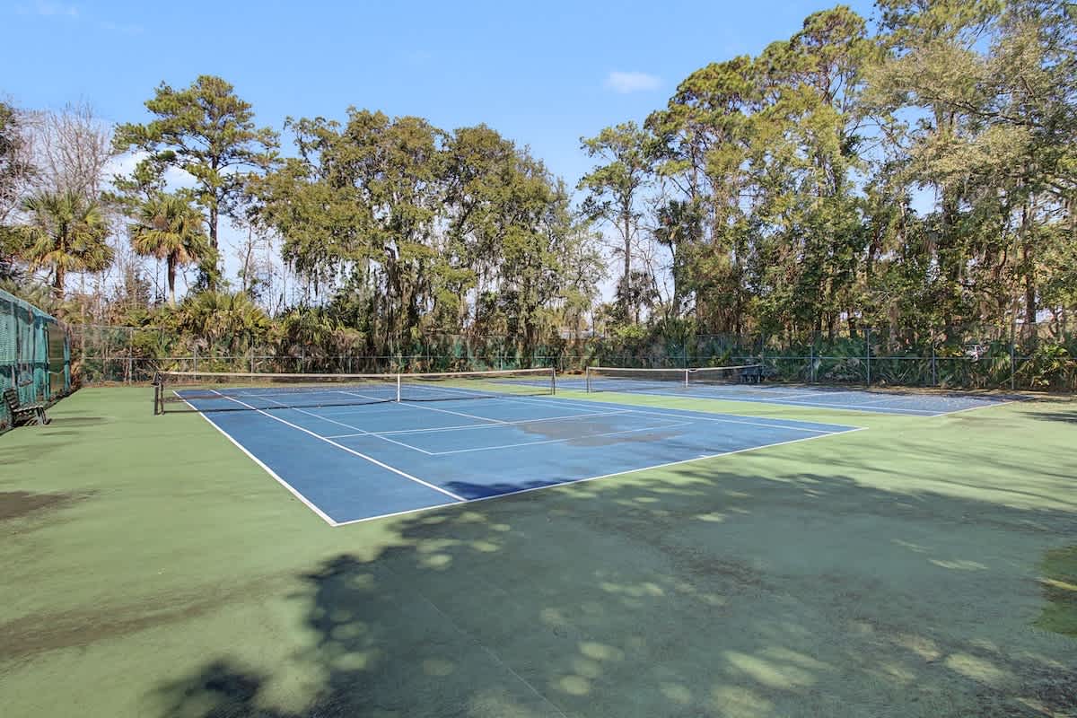 Challenge yourself on this private tennis court surrounded by lush tropical trees for an energizing match in paradise.