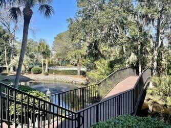 Tropical oasis surrounds this charming property with lush palms and mature trees creating your private retreat.