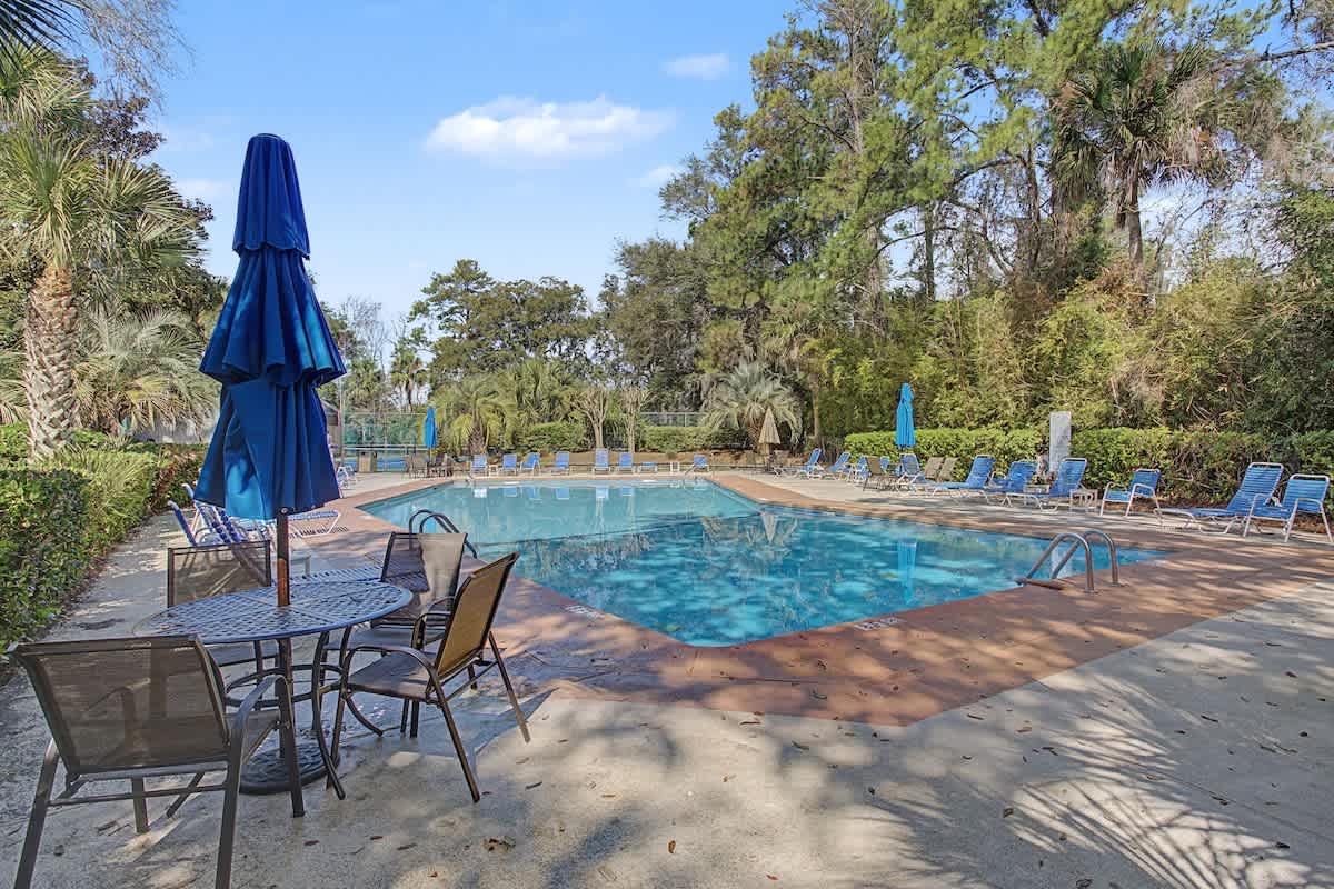 Sparkling pool surrounded by lush tropical gardens and comfortable loungers where you can relax under swaying palms.