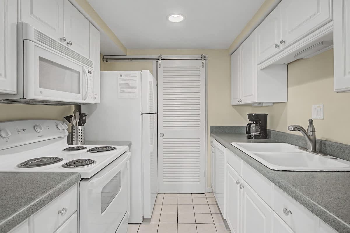 Your fully equipped galley kitchen features everything you need to prepare meals, with modern appliances and ample storage space.