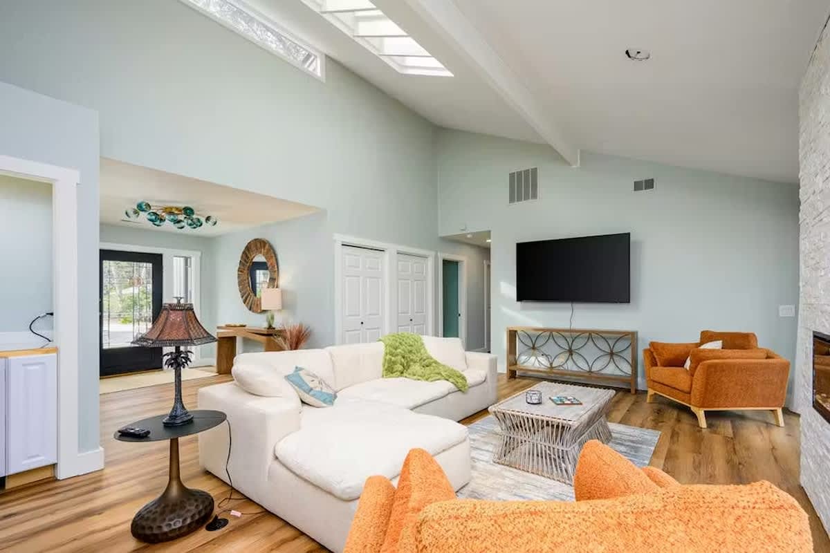 Sink into the plush sectional sofa and soak up natural light from your private skylight in this airy living space.