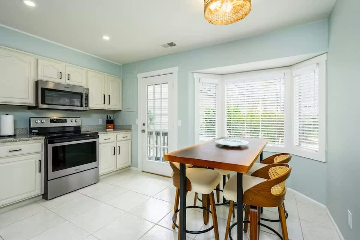 Your bright kitchen features modern appliances and a dining nook where you can enjoy meals bathed in natural light.
