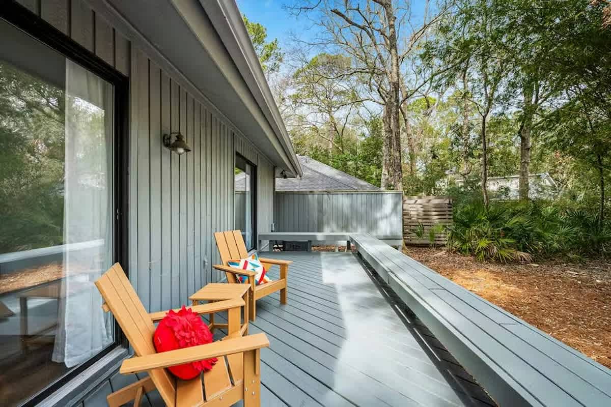 Step onto your private deck and sink into comfortable wooden chairs surrounded by peaceful trees and natural beauty.