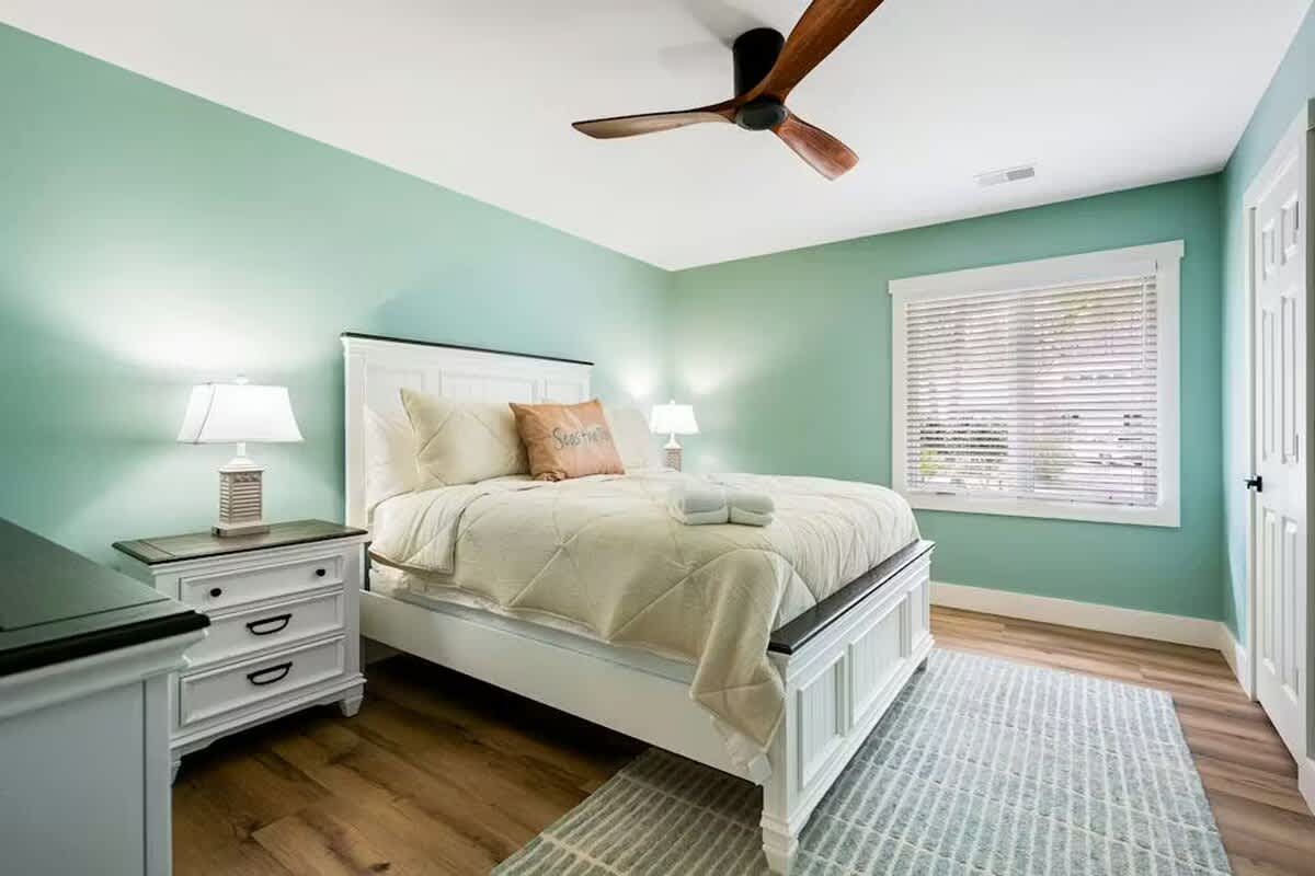 Drift off in your serene seafoam sanctuary, where coastal colors and crisp linens create the perfect escape for restful nights.