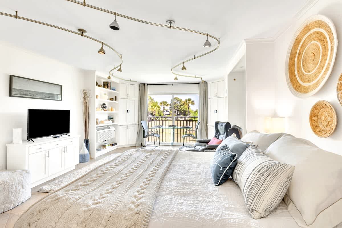 Settle into your bright, airy bedroom where coastal charm meets modern comfort. Natural textures and soft linens create the perfect retreat.