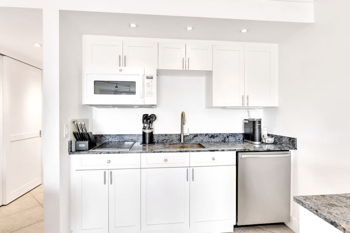 Your sleek kitchen features granite countertops, stainless steel appliances, and everything you need to prepare meals during your stay.
