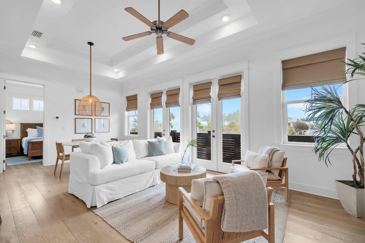 Living room includes plenty of seating and a smart tv for winding down in the evenings.