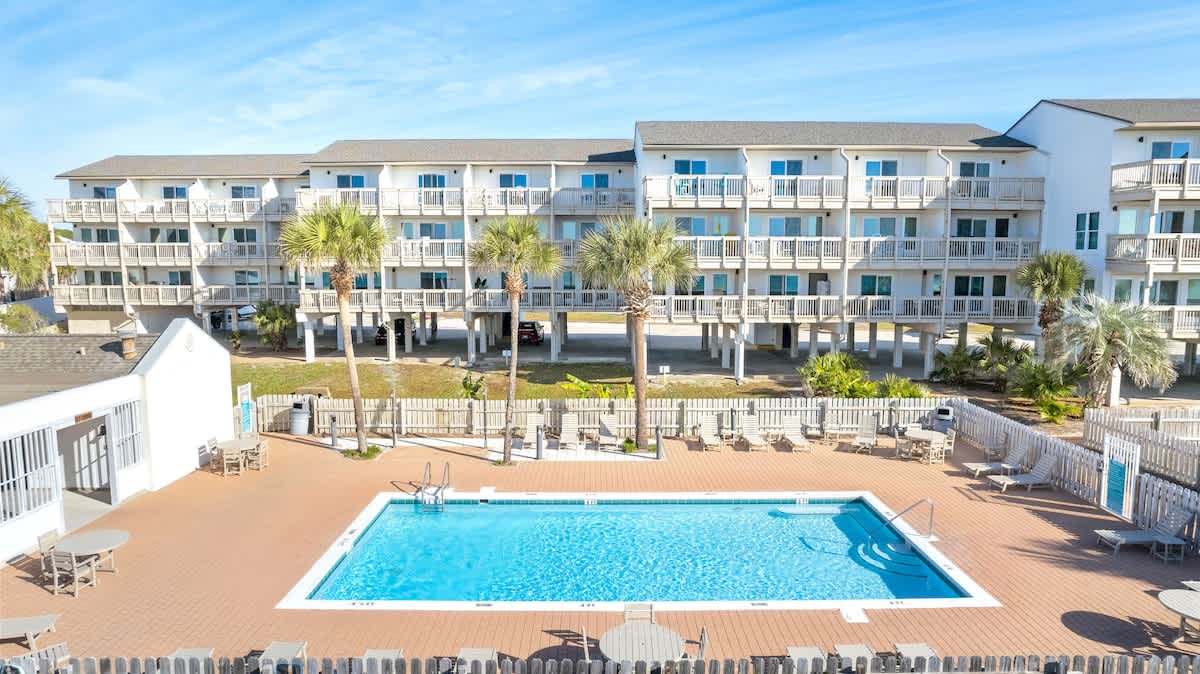 Community pool right outside the condo and steps from the ocean!