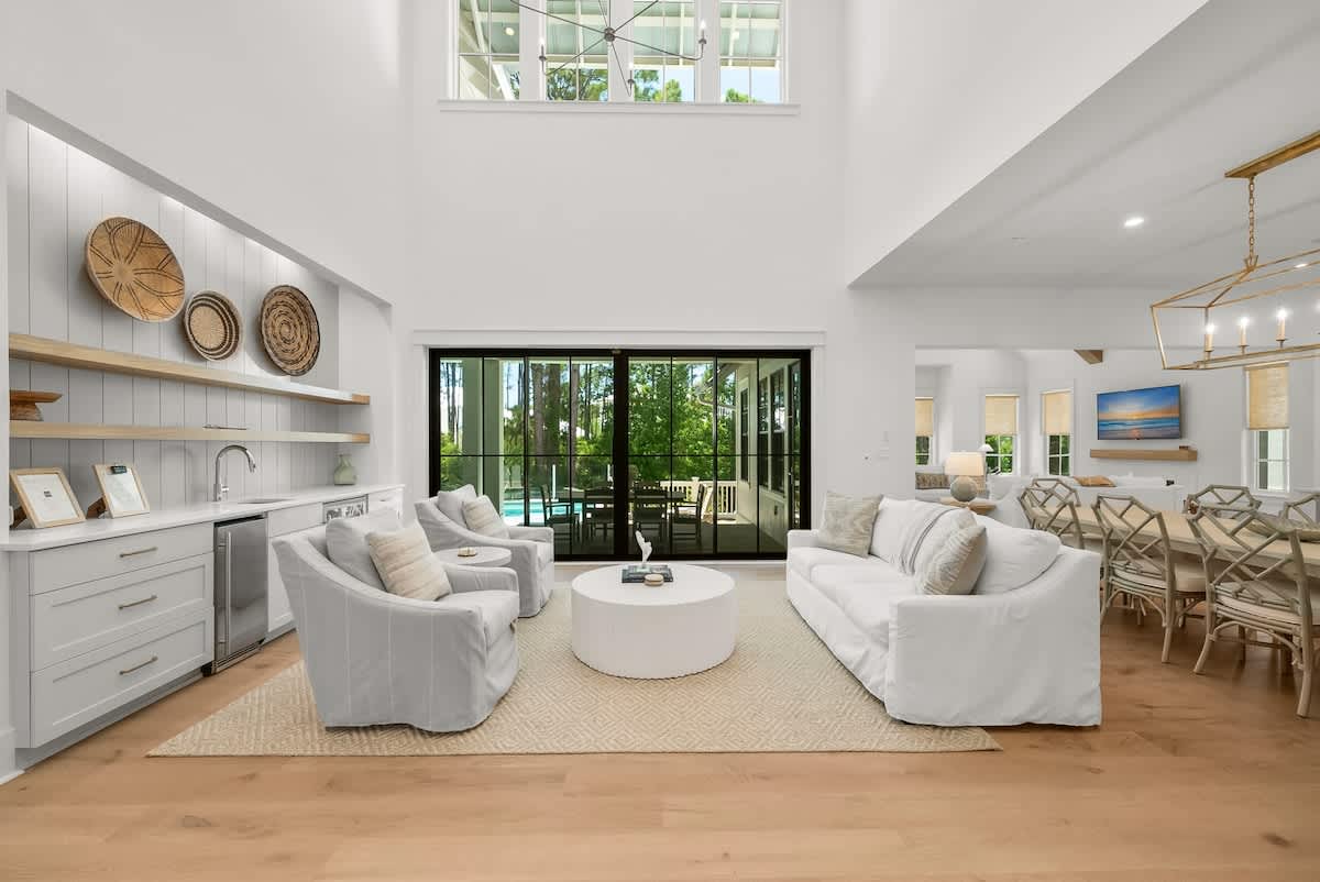 Den features a walkout to the private pool and a wet bar.