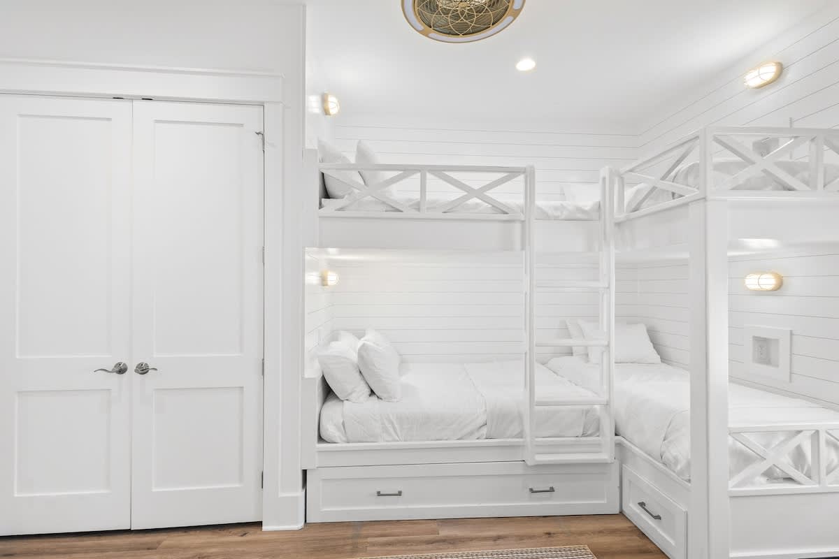Bedroom #2 features (1) full over full bunk with a twin trundle and (1) twin over twin bunk.