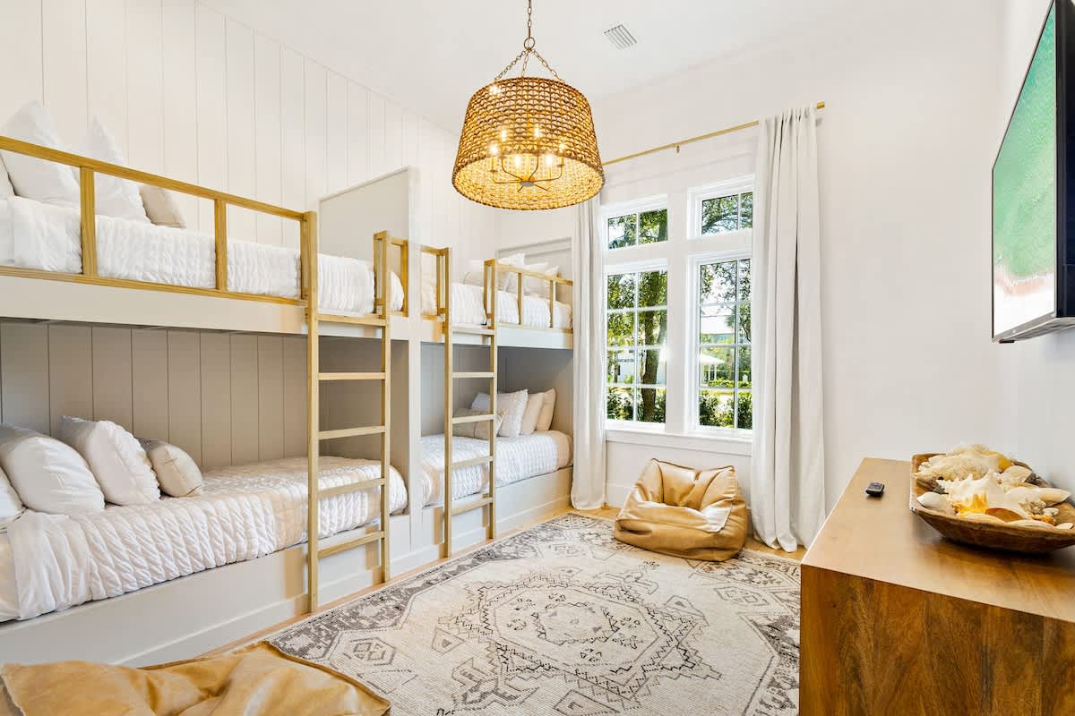 Bedroom #2 features (2) twin over twin built in bunks, a smart tv and ensuite.