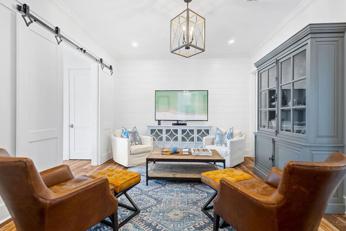 First floor living space features seating and a smart tv. Perfect for unwinding before bed.