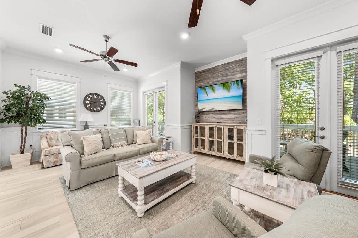 Living room space has a smart tv and plenty of seating for the family!