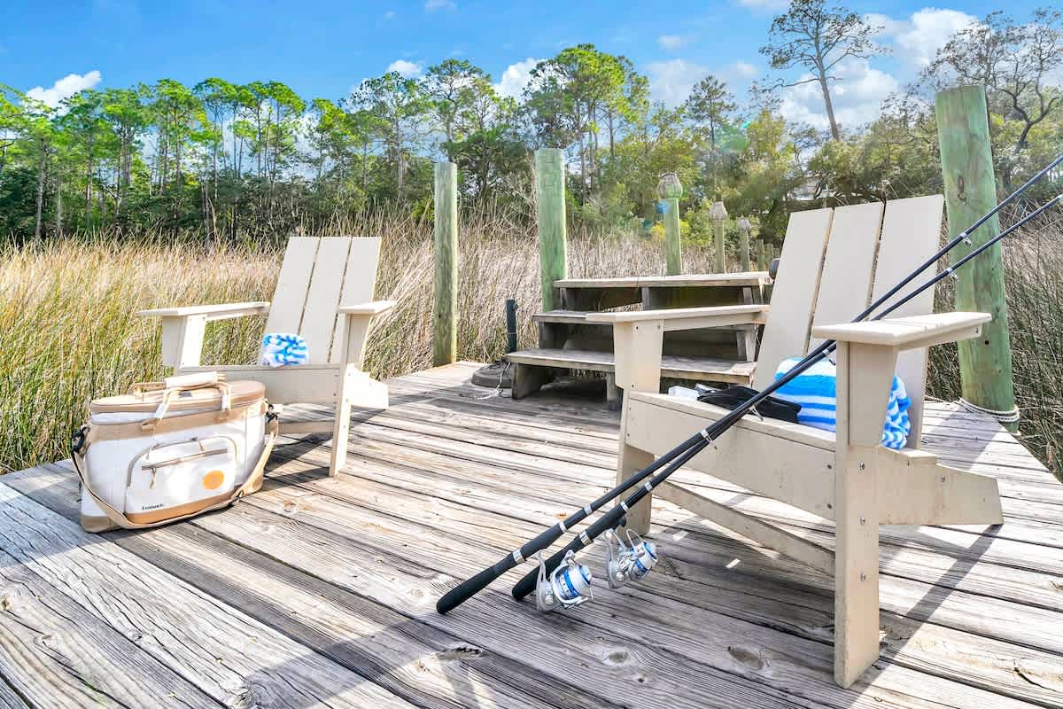 Private lake access in back of home with seating & fishing poles!