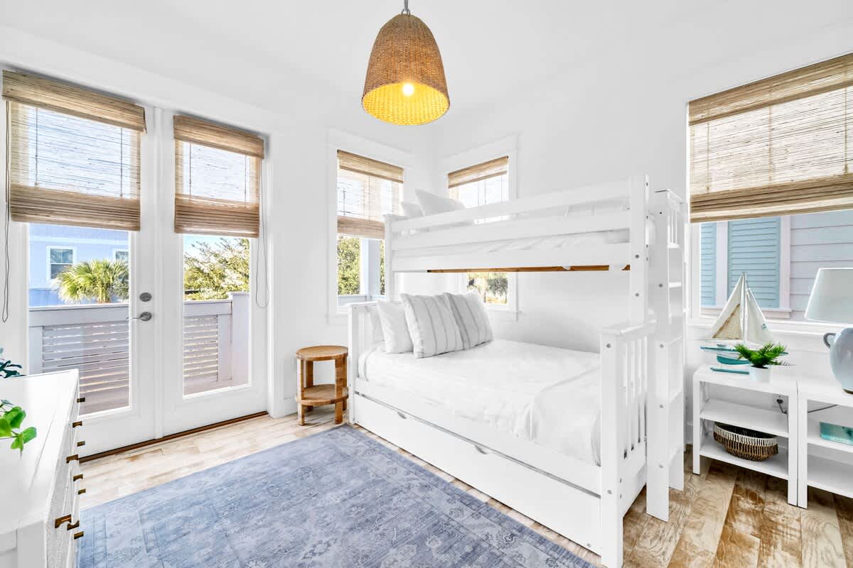 Guest bedroom features a twin over full bunk with a twin trundle and a smart tv.