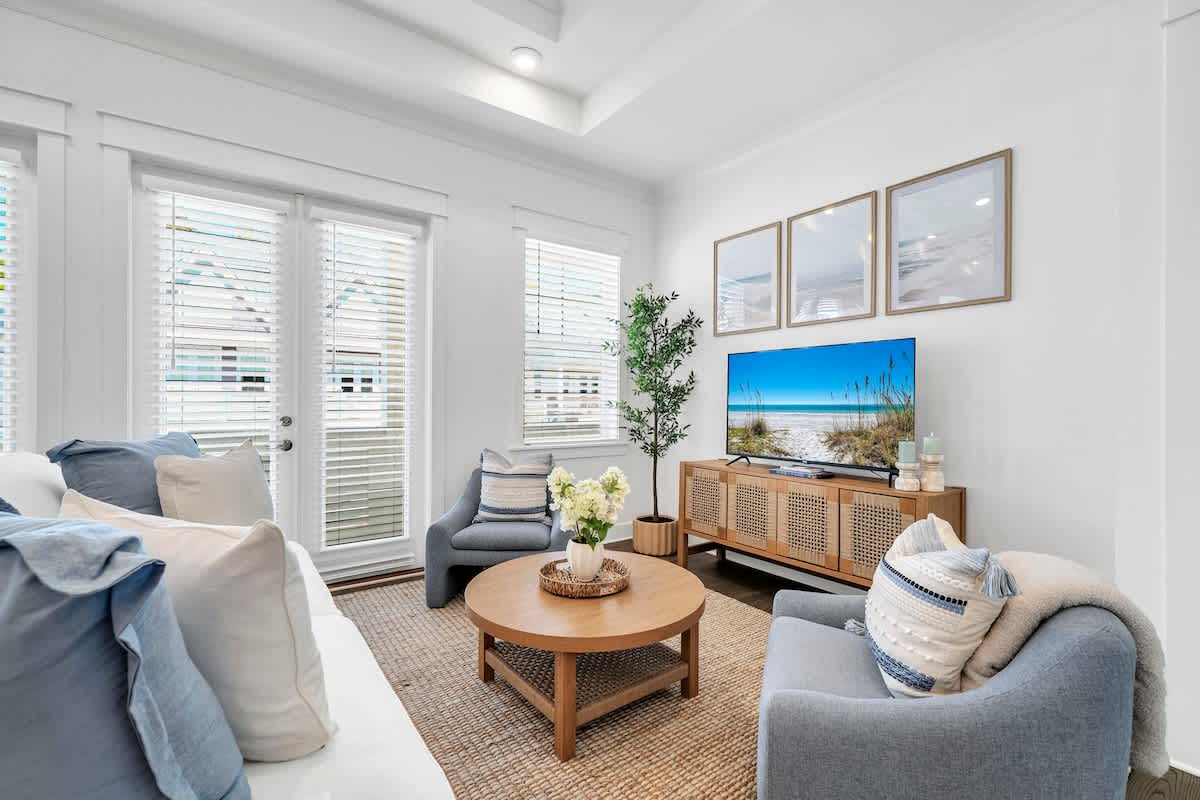 Living room features a queen sleeper sofa and smart tv