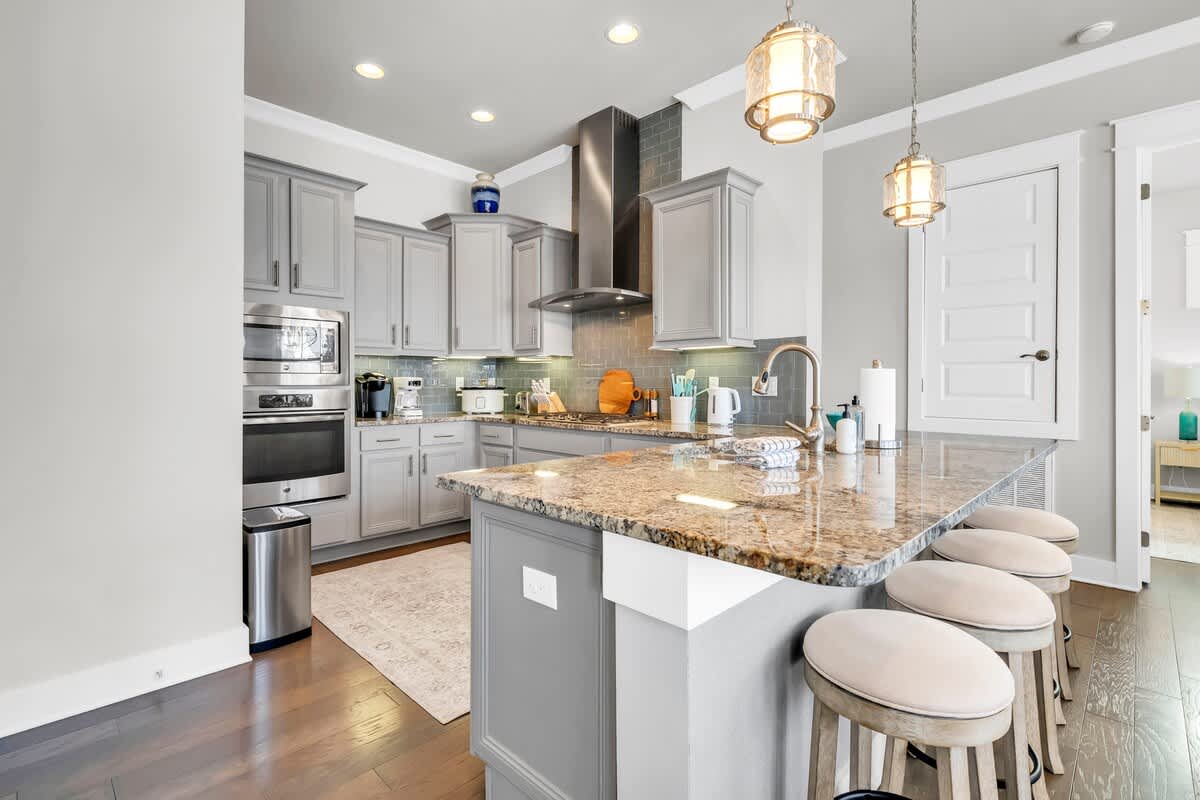 Enjoy the fully stocked kitchen with island seating