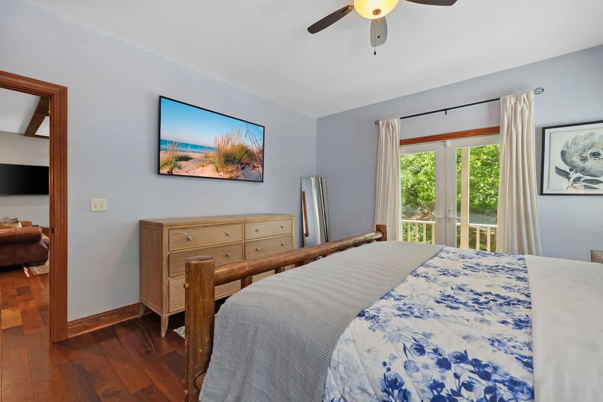 Enjoy bright views through double doors leading to a peaceful balcony.