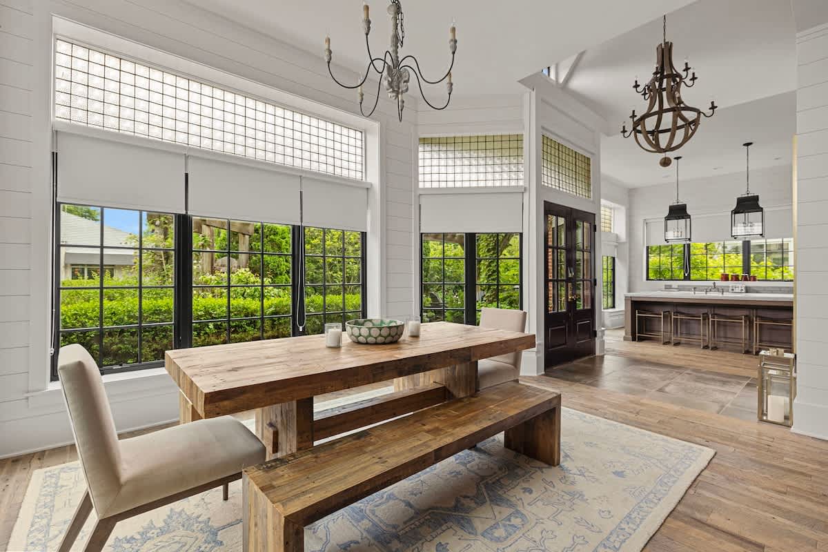 Dine in light-filled luxury under antique French window transoms with original glass block.