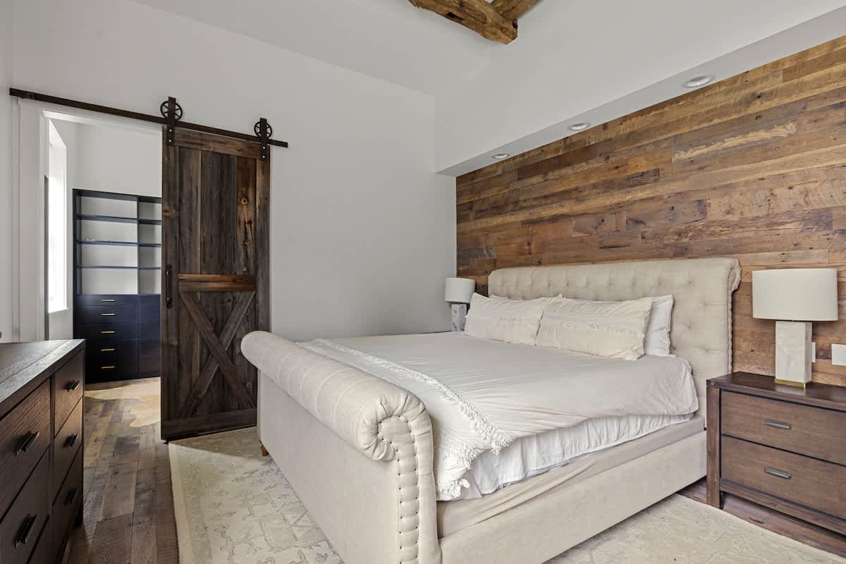 Primary bedroom is on the main level & has a king-size bed.