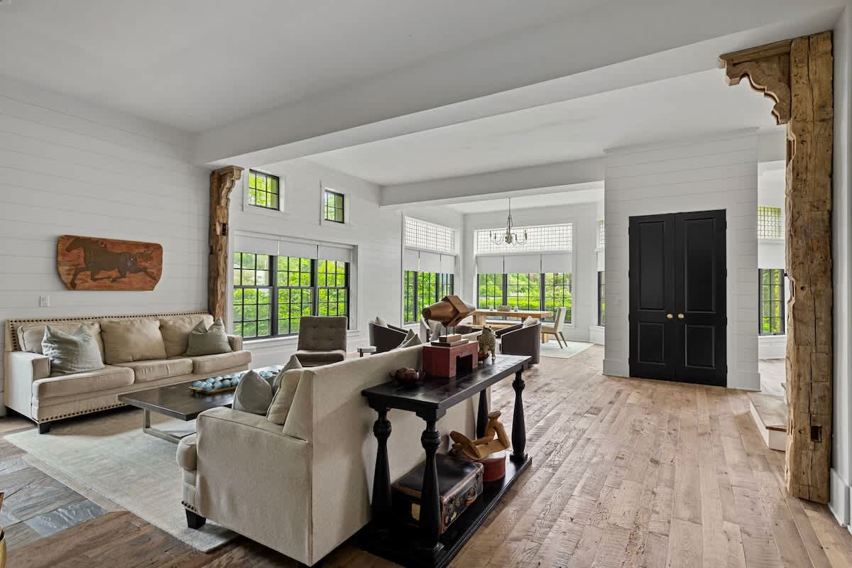 The Black Door Bungalow is filled with gorgeous, reclaimed wood flooring and antique beams.