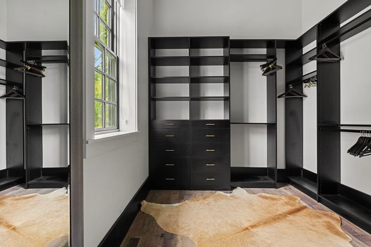 The main bedroom’s enormous walk-in closet is the envy of every guest.