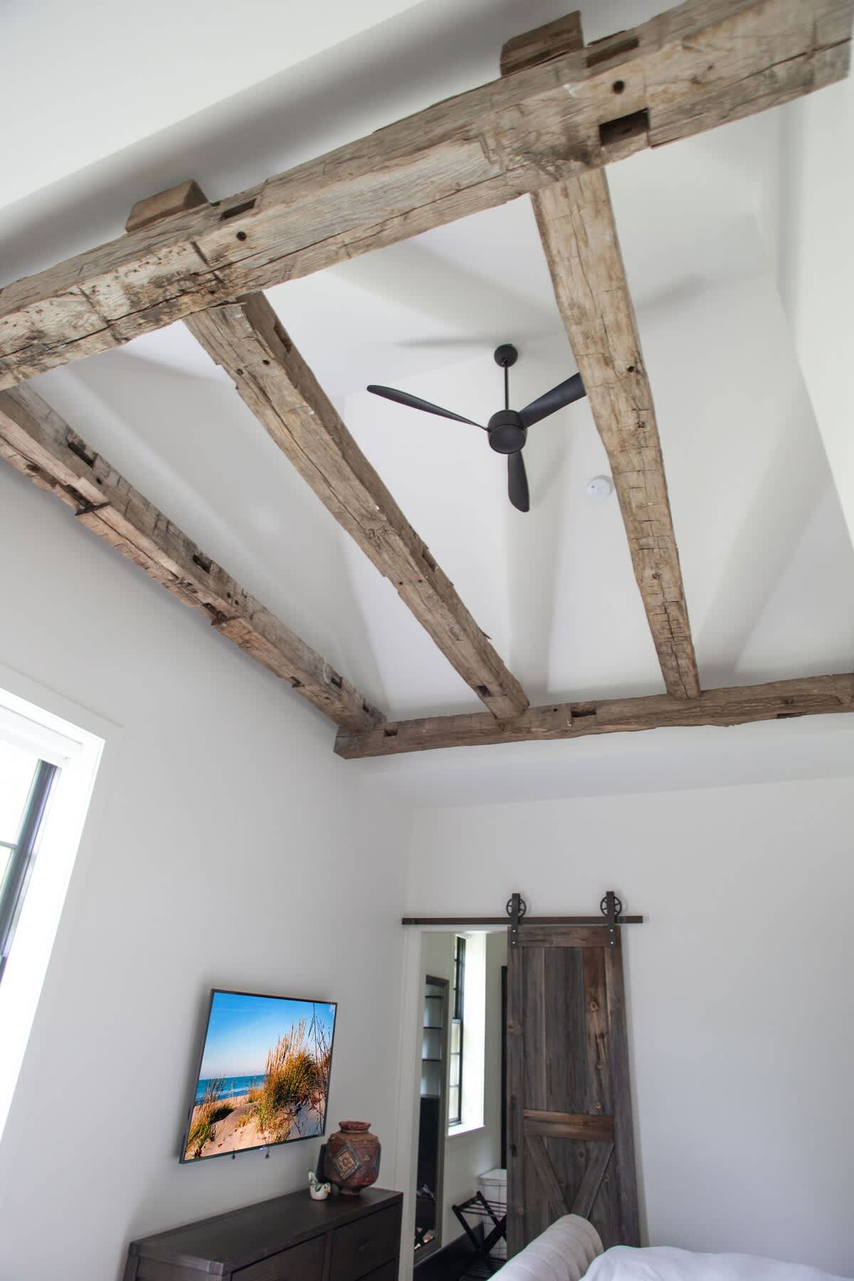 Antique beams, barn doors, and many other stylish design accents can be found throughout the home.