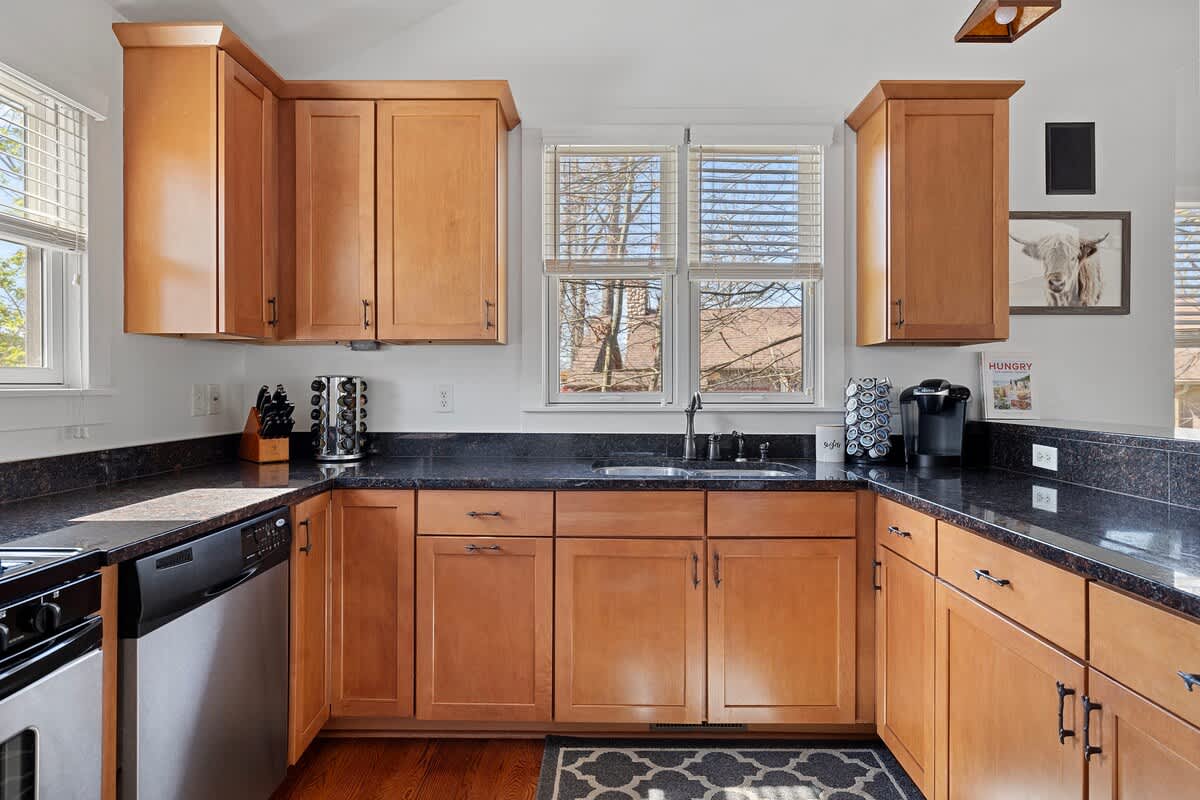 The kitchen's wraparound granite countertop space is great for large meal prep.