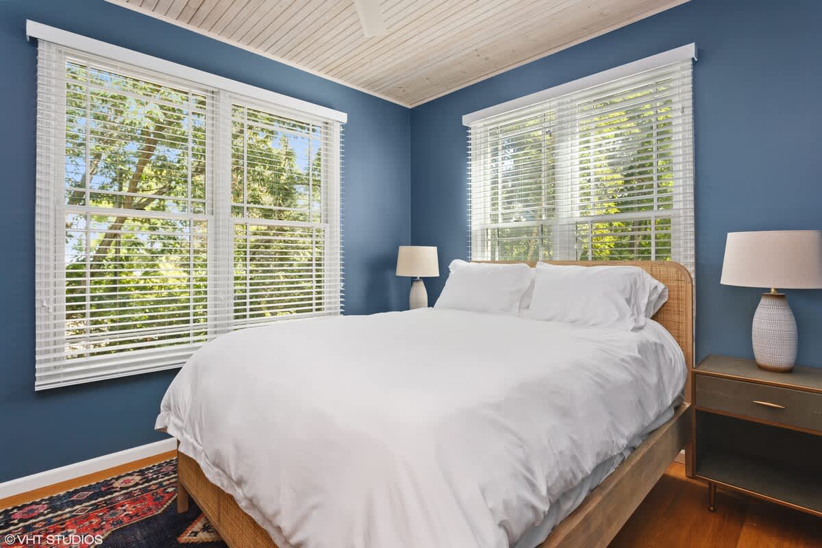 Bedroom 2 is on the main level & has a queen-size bed.