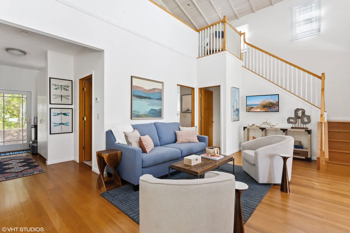 Bright and airy social spaces in this Nantucket-style residence are ideal for family gatherings.