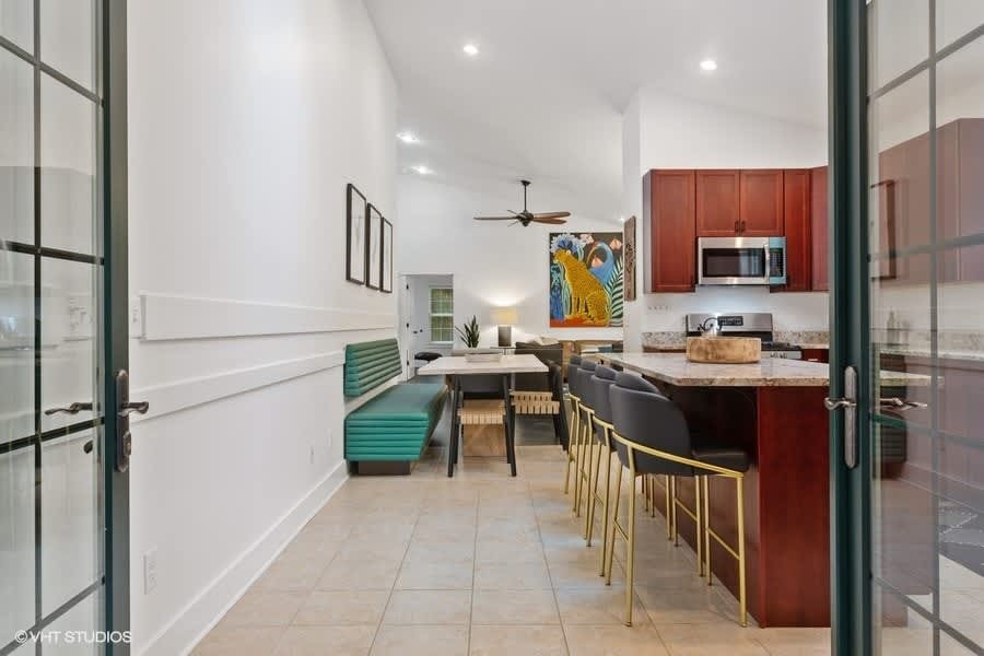 The spacious kitchen is highlighted by a large granite island.