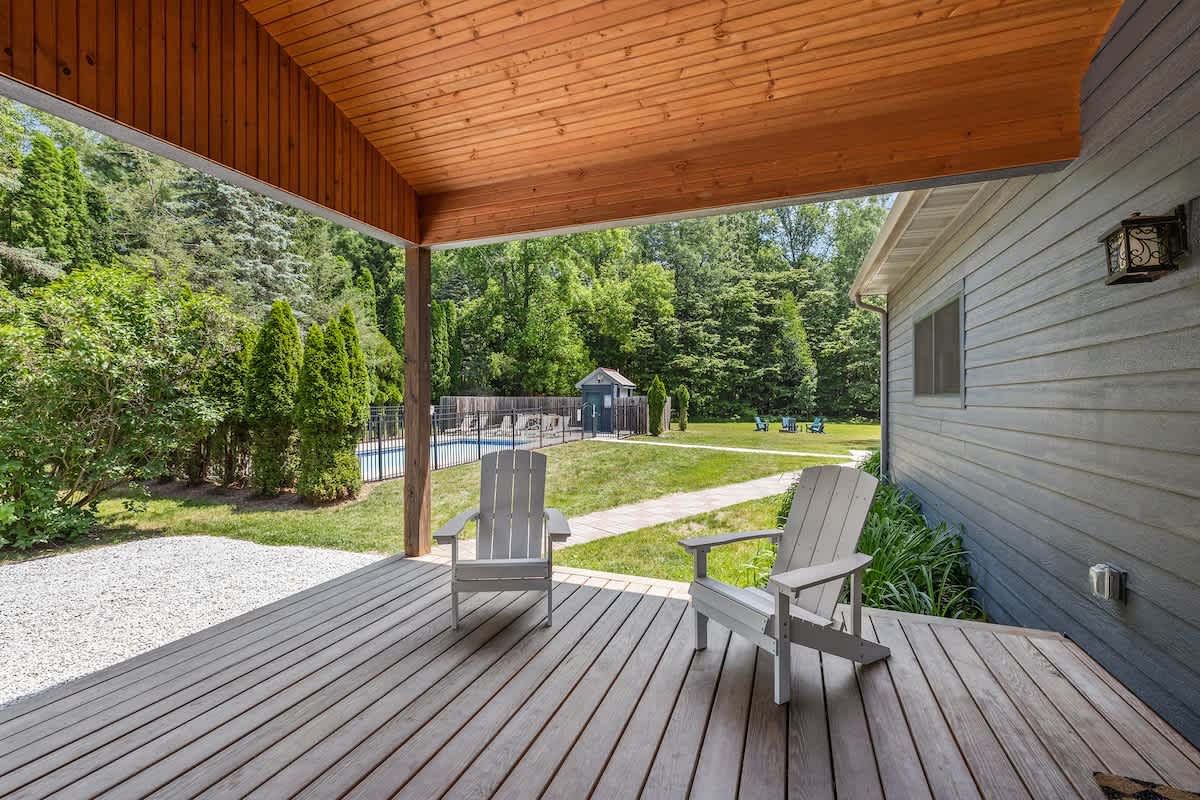 The covered porch is a wonderful place to escape with your morning cup of coffee.