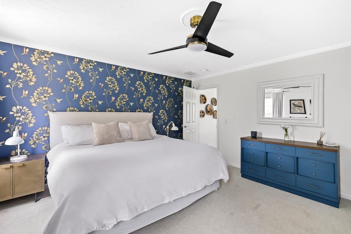 Primary bedroom has a king-size bed.