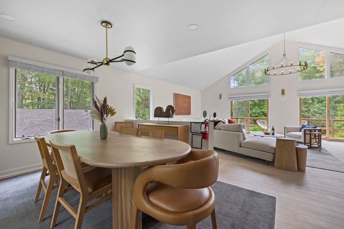 The dining room has an exquisite book matched teak dining table.