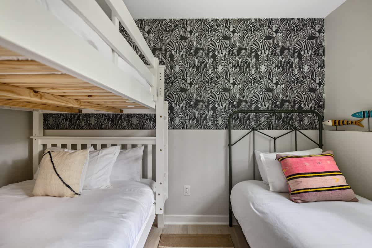 Bedroom 3 is on the lower level & has twin and full-size bunkbed.