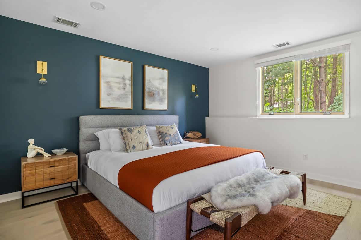 Primary bedroom is on the lower level & has a king-size bed.