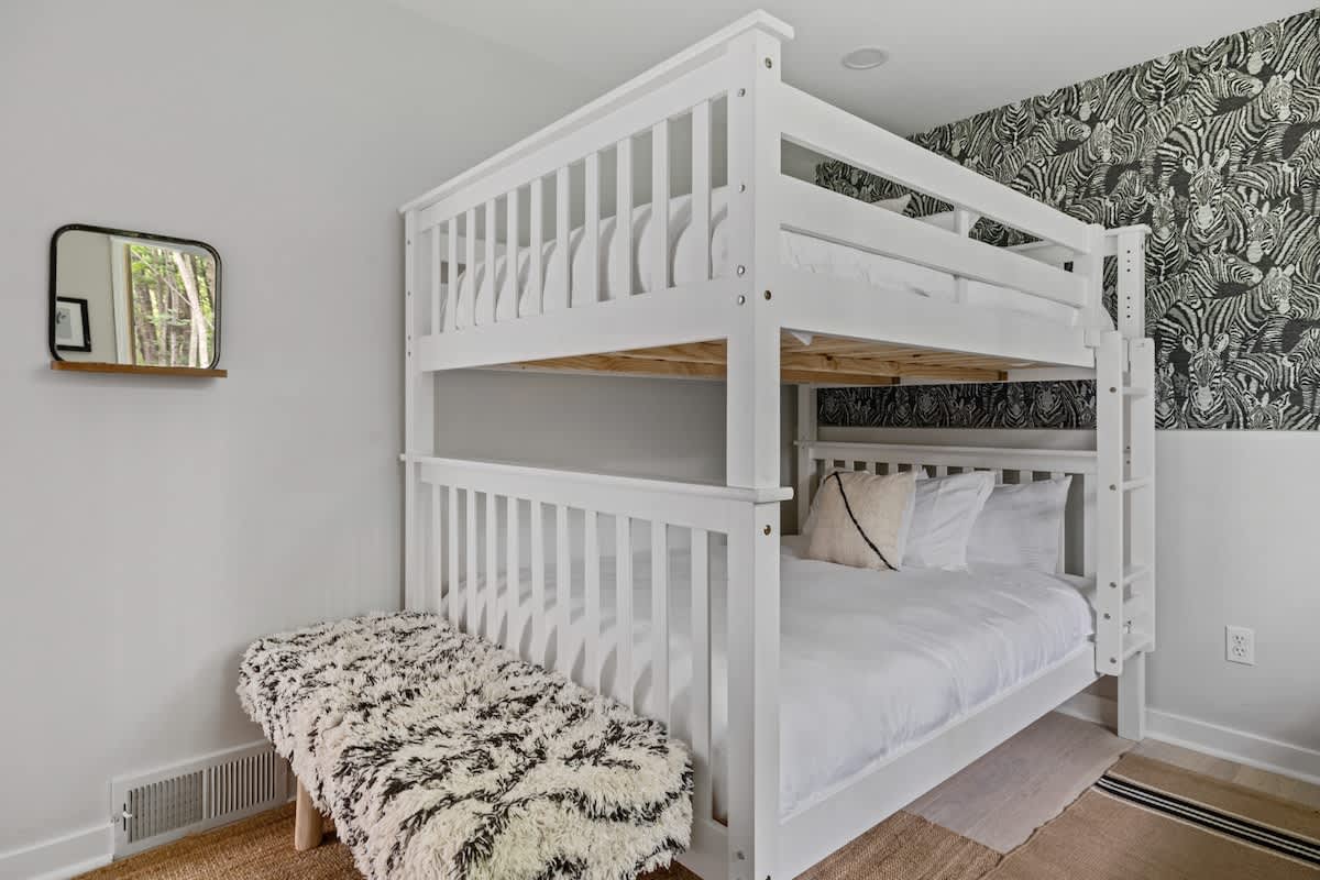 Enjoy a peaceful night's sleep in our charming bunkroom.