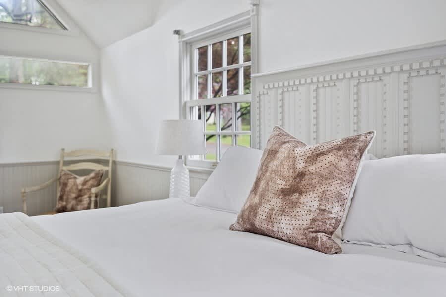 Primary bedroom is on the main level & has a king-size bed.