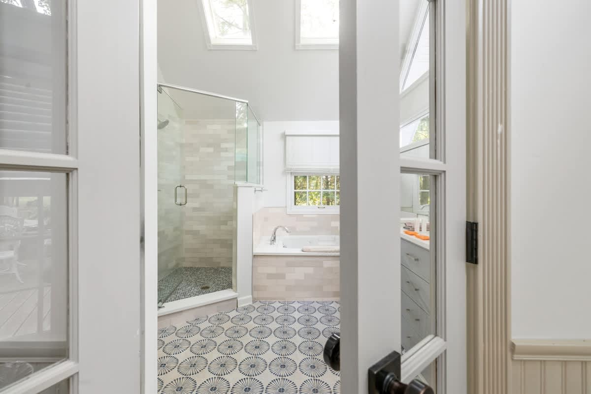 Spa-inspired bathroom with walk-in shower and soaking tub.
