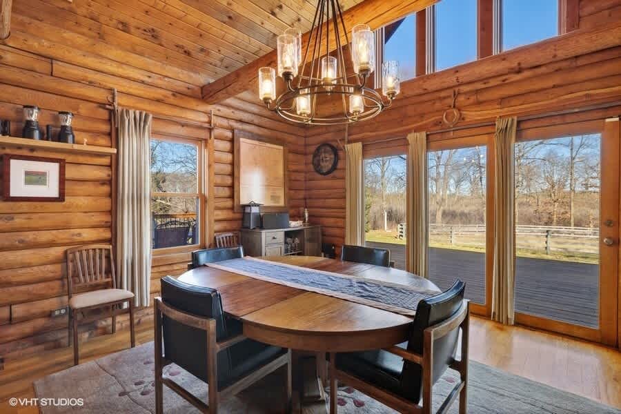 Gather around the dining table in the heart of this inviting and cozy home.